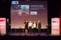 Pressereferentin Sabrina Banze mit der verantwortlichen Grafikerin Susanne Pobbig und Pressesprecher Thomas Hummitzsch (v.l.n.r.) bei der Preisverleihung der mediaV-Awards im Gloria-Theater in Köln